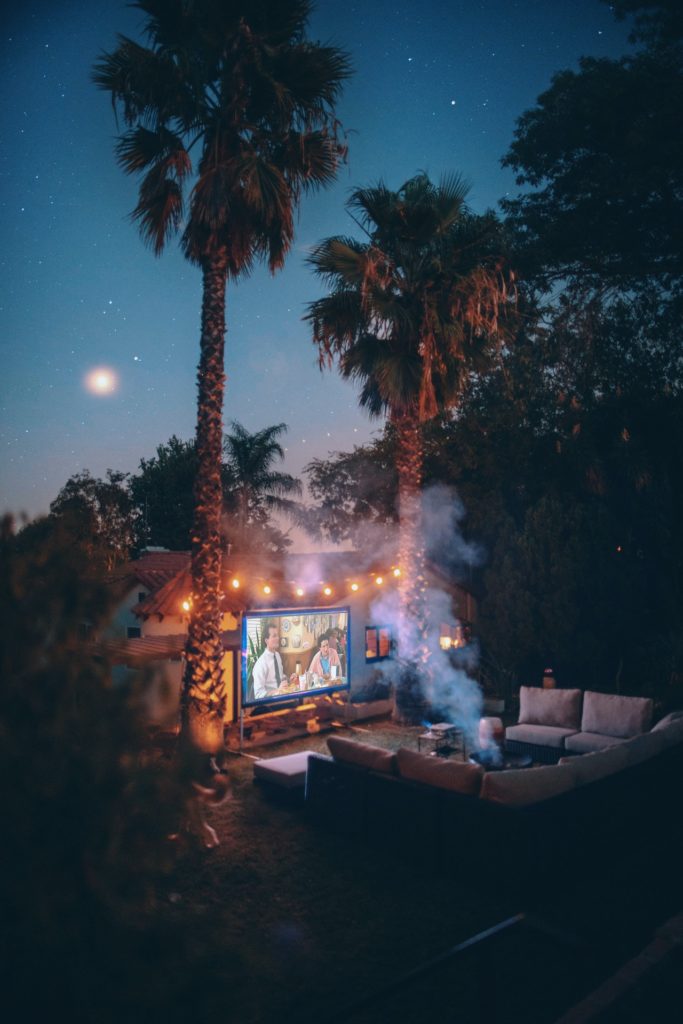 outdoor projector and couch are a luxury RV item 