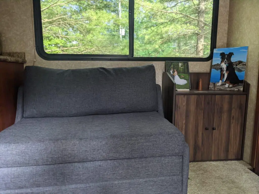 couch and shoe cupboard for RV organization 