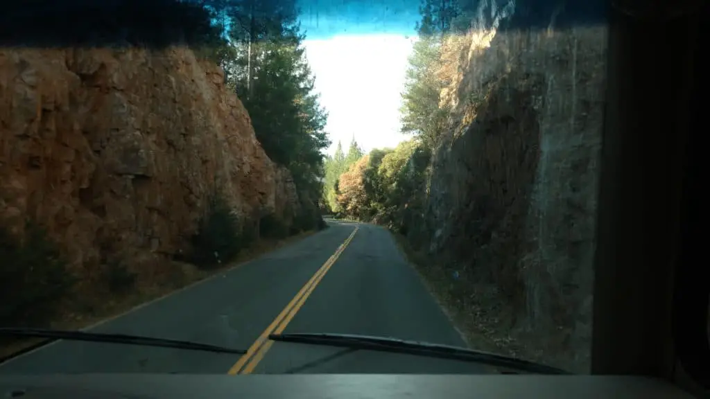 RV on narrow road on trip 
