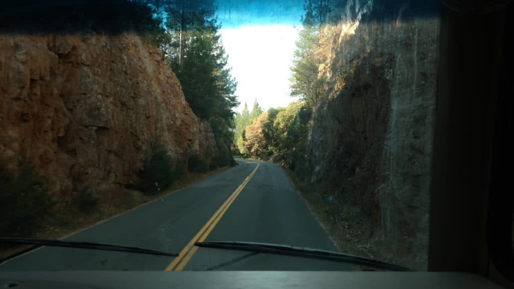 RV on narrow road on trip 