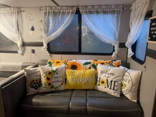 Throw pillows on the couch make this RV look nicer  