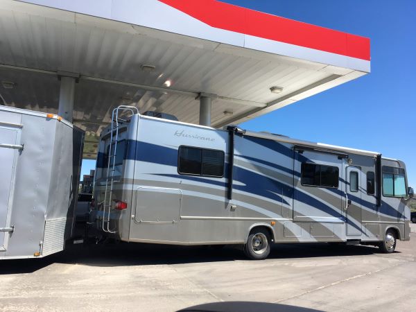 big rig RV at a gas station