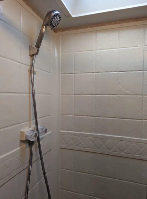 our RV shower with the new showerhead we installed before starting travel