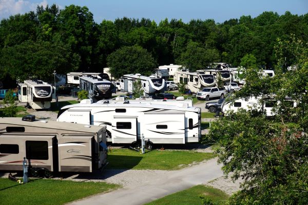 RV park with tight spaces and many RVs and trees