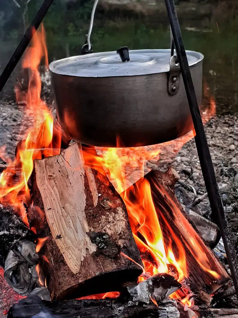 campfire cooking kits in use over a fire 